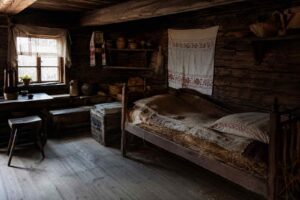 Jak spano w dawnych domach – łóżka, sienniki i nocne zwyczaje
