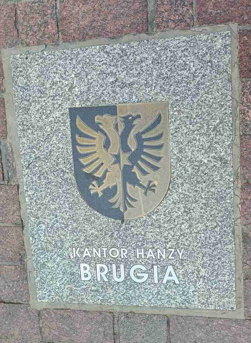 Znak kantoru Hanzy w Brugii przypomina o kupieckich związkach Torunia z Flandrią